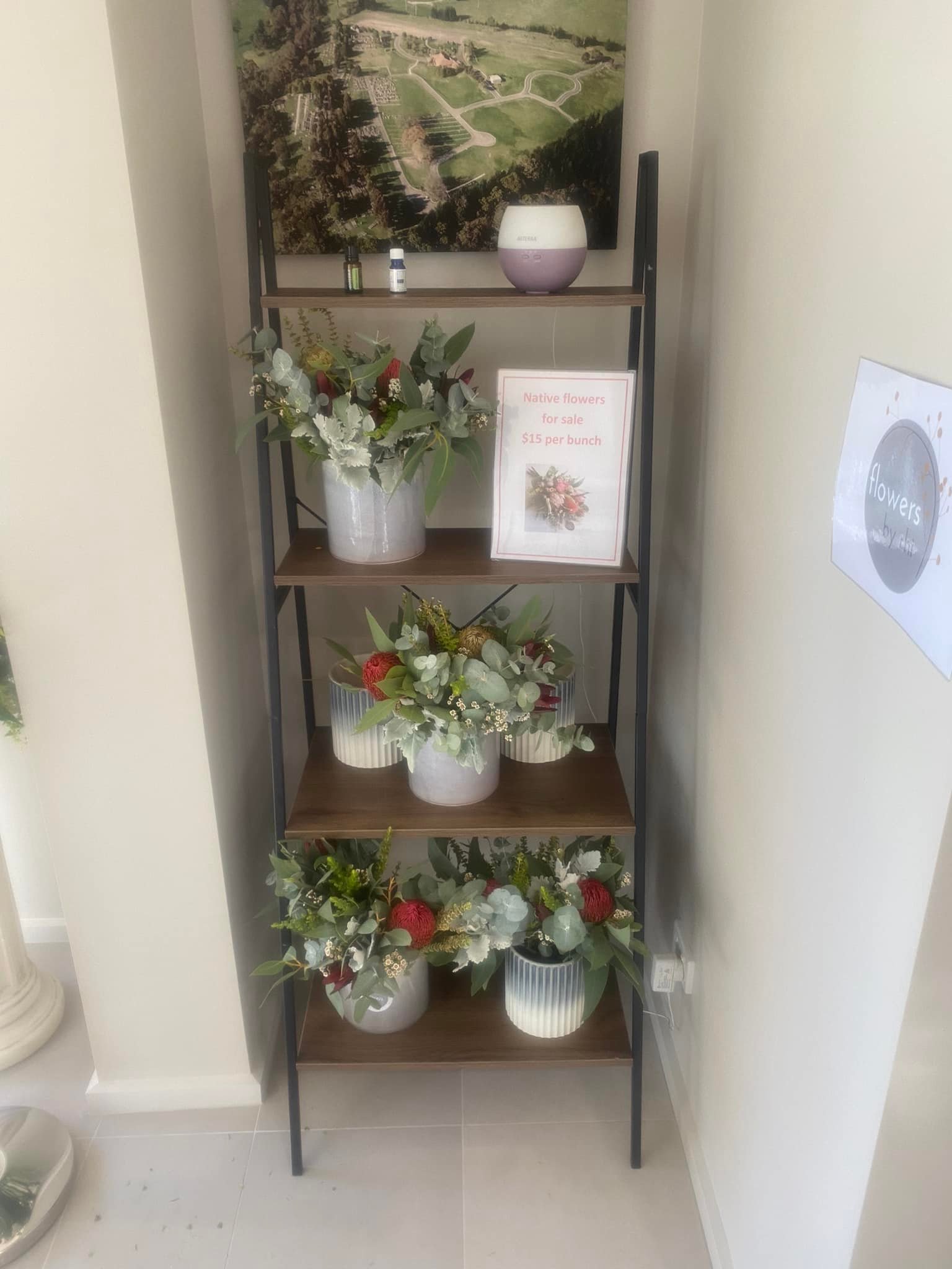 Pots of flower posies on a shelf