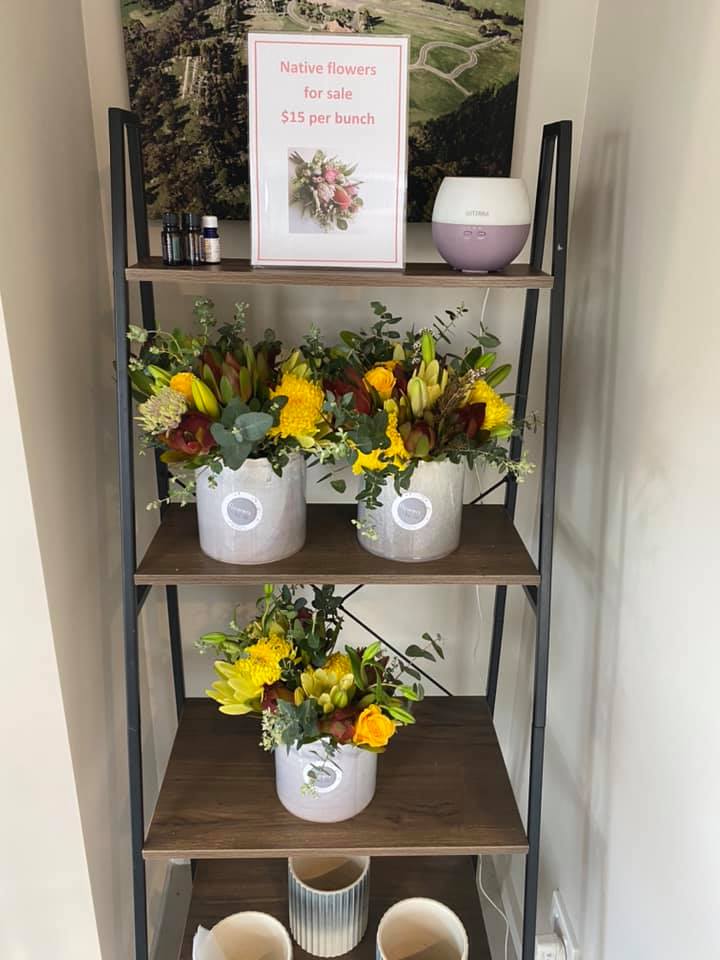 Pots of flower posies on a shelf