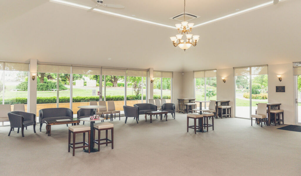 Chairs and large windows in the function room at Gippsland Memorial Park