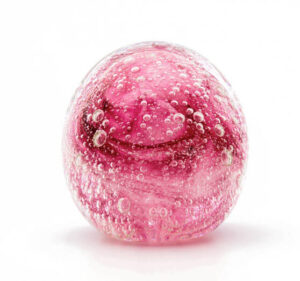 Pink glass dome paperweight